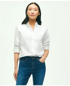 Our shirt is crafted from Oxford cotton with our signature button-down collar and 6-Pleat Shirring® at the cuff, for a nod to timeless American style. Classic silhouette that is straight in the bodyEmbroidered logo at chest100% CottonMachine washImported | Women's Classic-Fit Cotton Oxford Shirt | White | Size 2 Classic Tops With Fold Down Collar For Daywear, Classic Collared Tops For Daywear, Classic Top With Fold Down Collar For Daywear, Classic Slim Fit Daywear Blouse, Classic Slim Fit Blouse For Daywear, Classic Everyday Shirt With Buttons, Classic Everyday Blouse With Button Cuffs, Classic Everyday Blouse, Classic Shirt With Spread Collar For Everyday