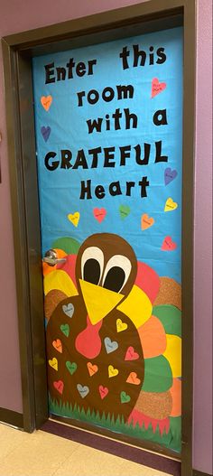 a classroom door decorated with a turkey and saying,'enter this room with a grateful heart '