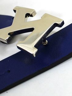 Kiton | Kiton Belts Kiton Luxury: Genuine Kiton belt, narrow (7/8" width) lapis blue leather belt with K silver tone buckle, hand made in Italy. Kiton Napoli men's collection. Discount sartorial quality hand made belts.Belt Sizing: Purchase 2" longer than your waist size. Color: Lapis Blue/ Silver Tone Buckle Fabrics: Genuine Leather Size: 100cm / 40" (Fits 37"- 38" Waist)Narrow 7/8" Width / 2.3cm Origin: Hand Made in Italy Brand: Kiton Napoli Original Kiton Gift Box Genuine/ Authentic Product C Luxury Blue Belt For Formal Occasions, Kiton Women, Luxury Blue Formal Belt, Blue Leather Belt Buckles With Removable Belt, Luxury Blue Leather Belt, Designer Ties, Lapis Blue, Ermenegildo Zegna, Brunello Cucinelli