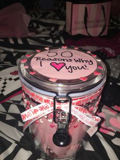 there is a cake in the jar with ribbon around it that says i love you