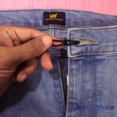 someone is opening the zipper on their jeans