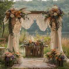 an outdoor wedding setup with flowers and greenery