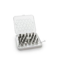 a set of screws in a case on a white background