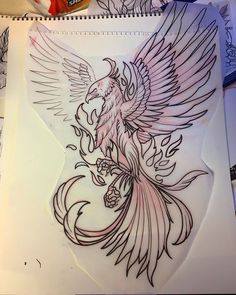 a drawing of a bird with wings and flowers on it's back, sitting on top of a table