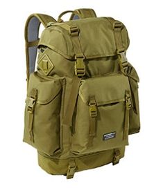 the back pack is tan and has multiple compartments