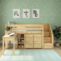 a bedroom with green walls and white stars on the wall next to a wooden bunk bed