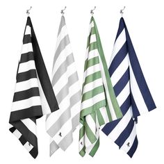 four different colored towels hanging from hooks