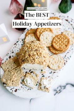 the best holiday appetizers on a plate with crackers, cheese and crackers