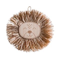 a wooden ornament with a bear on it's face and a furry tail