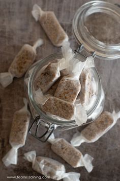 a jar filled with marshmallows on top of a table