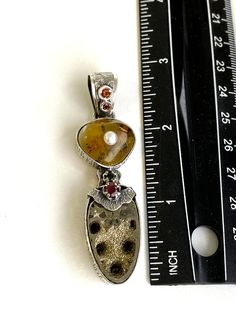 "Artisan Fossil gemstone pendant Hand-made Sterling Silver 925 Stones used: Baltic Amber, Ammonite-Fossil, Ruby, Pearl, Garnet, Citrine Height - 2 3/4\" (with bail), Width - 3/4\" Unique Handcrafted One-of a-kind Design Pendant Each Piece of Jewelry in my Collection is Absolutely One of a Kind! When you start wearing a piece of my jewelry you will fall in love with it more and more each day and feel that good Energy and Love that I pass into it while creating this piece of Art. A piece of Art cr Fusion Style Pearl Pendant Jewelry As Gift, Fusion Style Pearl Pendant Jewelry For Gift, Unique Pearl Pendant Jewelry, Artisan Sterling Silver Pearl Pendant Jewelry, Artisan Sterling Silver Jewelry With Pearl Pendant, Unique Gemstone Heart Pendant Jewelry, Unique Pearl Pendant Necklace For Anniversary, Heart Pendant Multi-stone Jewelry Gift, Multi-stone Heart Pendant Jewelry As Gift