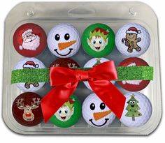 christmas themed golf balls in a plastic container