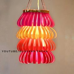 a chandelier hanging from the ceiling with different colors