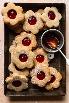 cookies with jelly in the middle and powdered sugar on top