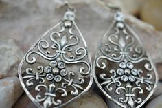 This is the perfect option for those who like cool, unique jewelry and the luxury, shine of silver. The pierced earrings have a shape of drops. The earrings have filigree design and the earrings are decorated with crystals. It is perfect for a gift for birthday, mother's day and holidays. ❤️ The earrings are about 1 2/4'' by 7/8''(in the widest place). ❤️ There is a hallmark: 925.Thailand. Everyone interested in the jewelry should remember that he or she must like their jewelry- not just at firs Silver Metal Crystal Earrings For Anniversary, Silver Metal Plug Earrings As Gift, Silver Dangle Plug Earrings For Gifts, Ornate Silver Plug Earrings As Gift, Ornate Silver Plug Earrings For Gift, Unique Silver Plug Earrings For Jewelry Making, Ornate Silver Pierced Plug Earrings, Silver Sterling Plug Earrings For Anniversary, Silver Nickel-free Drop Crystal Earrings