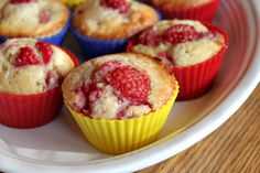 some raspberry muffins are on a plate