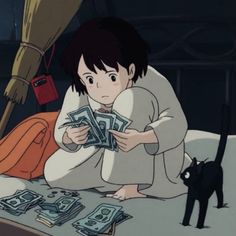 a person sitting on a bed with money in front of them and a black cat standing next to her