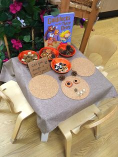 the table is set up with several items for children to play in and around it