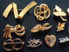 "These Are a Beautiful Vintage 13 Piece Lot All Kind of Jewelry Brooches Pins & Scarf Clips or Shoe Clips? Gold Tone Silver Tone Metal With Rhinestone Flower Leaves Leaf Heart Ribbon Bow Geometric Brooch Pin These lovely vintage pins/brooches are in very good to good vintage condition, with very small normal/minor signs of wear to the plating finish. These brooches are clean and ready to wear. For more a GREAT DEALS on vintage jewelry and accessories lots please see our \"Wholesale Lots\" Sh Gold Brooches For Formal Valentine's Day, Gold Brooches For Valentine's Day Formal, Gold Brooches For Valentine's Day, Elegant Gold Brooch For Valentine's Day, Elegant Gold Brooches For Valentine's Day, Valentine's Day Gold Jewelry Brooch, Valentine's Day Gold Brooch Jewelry, Valentine's Day Gold Brooch, Geometric Brooch