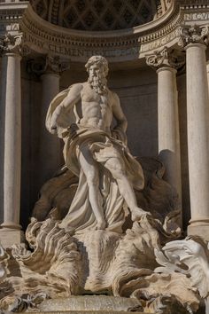 an image of a statue in the middle of a building with columns and statues around it