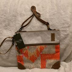 Myra Crossbody Or Wristlet. Leather Straps And Wristlet Strap Can Be Removed Via Lobster Clasp. This Is A Mixture Of Hide, Leather And Canvas. Large Front Zipper Compartment. Zipper Closure With 2 Open Pockets And A Zipper Pocket Inside. Lots Of Detail On This Bag! Leather And Canvas, Turquoise Leather, Jute Bags, Orange Bag, Crossbody Messenger Bag, Small Crossbody Bag, Orange Brown, Canvas Leather, Cowhide Leather