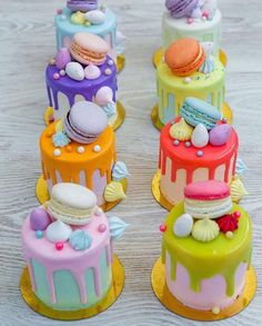 there are four cakes that have different designs on each cake, and one is decorated with colorful icing