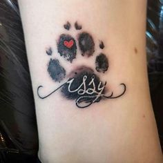 a paw print with the word kiss written in cursive writing and a red heart