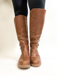 Our popular Wide Calf Boots are back!!! These are your perfect everyday essential boot for fall! These have a faux leather look with that cross over buckle detail. There is a zipper to give you easy access to slip these on. But the best part is the STRETCH these boots have in the calves. These boots are 18 inches tall and will fit up to an 22 inch calf. True to size. Half sizes, size up in these boots. Made of Vegan leather in the front, back is a stretchy ribbed fabric Corkys Wide Calf Boots, Wide Calf, Wide Boots, Calf Boots, Ribbed Fabric, Easy Access, Everyday Essentials Products, Vegan Leather, Faux Leather