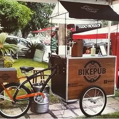 a bike is parked next to a food cart