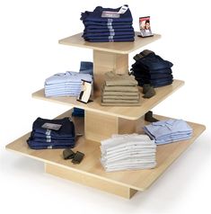 three tiered wooden display with folded shirts on the bottom and folded jeans on top