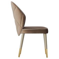 an upholstered chair with gold legs and a brown seat pad on the back