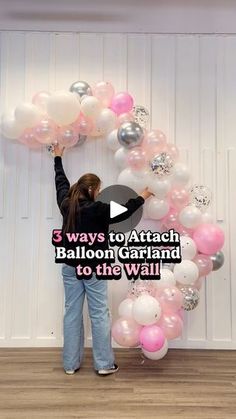 a woman standing in front of balloons with the words 3 ways to attach balloon garland to the wall