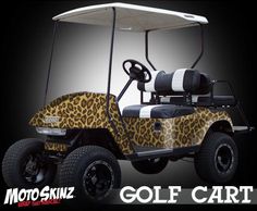 an animal print golf cart with the words motoskinz on it