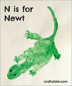 a drawing of a green gecko with the words n is for newt on it