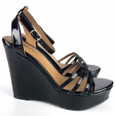 Avery Patent Pu Strappy Wedges Patent Pu Manmade Materials Strappy Ankle Buckle Closure Available Color: Black Approx. Heel Height: 4.75" (For Size 8) Approx. Platform Height: 1.5" (For Size 8) Imported Trendy Adjustable Wedge Sandals For Party, Black Wedge Sandals For Summer Nights, Black Wedge Sandals For Summer Night Out, Chic Black Wedge Sandals For Day Out, Black Strappy Synthetic Wedge Sandals, Black Synthetic Wedge Sandals For Day Out, Trendy Black Adjustable Wedge Sandals, Trendy Black Wedge Sandals For Night Out, Black Wedge Sandals For Spring Night Out