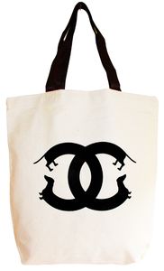 a tote bag with the word chanel printed on it and an image of two cats