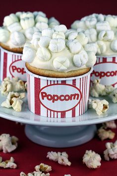 popcorn cupcakes with marshmallow topping on a cake plate