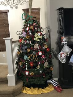 a decorated christmas tree in the corner of a room