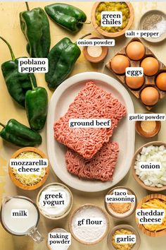 the ingredients for ground beef are shown in bowls and on separate plates, including eggs, flour, garlic, green peppers, onion, eggplant, gravy