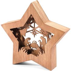 a wooden ornament with the nativity scene in it's star shape