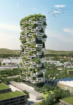 a tall building with lots of green plants on it's sides and birds flying overhead