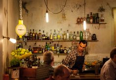 a group of people sitting at a bar