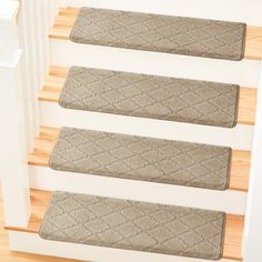 three stair mats on the bottom of stairs