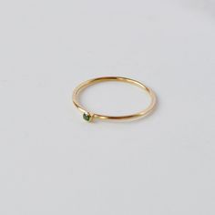 A super cute, tiny Emerald CZ stone ring gives you that barely there feel, with a touch of sparkle. Looks great alone or added to your daily stack! 14K Gold Filled Band is 1mm, CZ stone is 2mm Listing is for ONE RING Gold Filled has 100 times more gold than gold plated jewelry and will not chip or fade with wear! You can swim/shower, etc just like you would with solid gold. Gold filled wire is created by taking a sheet of 14 karat gold and bonding it through extreme heat and pressure to a core o Minimalist Stackable Crystal Promise Ring, Minimalist Birthstone Midi Rings For Everyday, Dainty Everyday Crystal Ring With Birthstone, Everyday Midi Rings With Birthstone In Round Band, Everyday Birthstone Midi Rings With Round Band, Dainty Everyday Crystal Birthstone Ring, Dainty Crystal Birthstone Ring For Everyday, Everyday Birthstone Midi Rings, Minimalist Gemstone Midi Rings For Promise