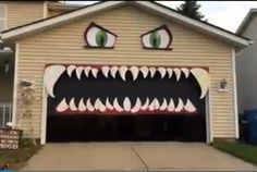 a garage with a monster face painted on it