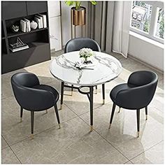 a dining table with four chairs around it