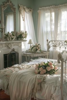 a white bed sitting in a bedroom next to a window