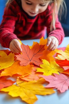 Child playing with colorful paper leaves on a table. Crafts With Fall Leaves, Fall Crafts Toddlers, Fall Leaves Crafts Preschool, Apple Crafts Preschool, Harvest Activities