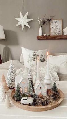 a tray filled with christmas decorations on top of a bed