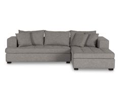 a gray sectional couch with pillows on it and the back end facing off to the side